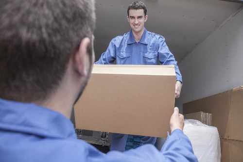 A moving team preparing items safely before a van relocation