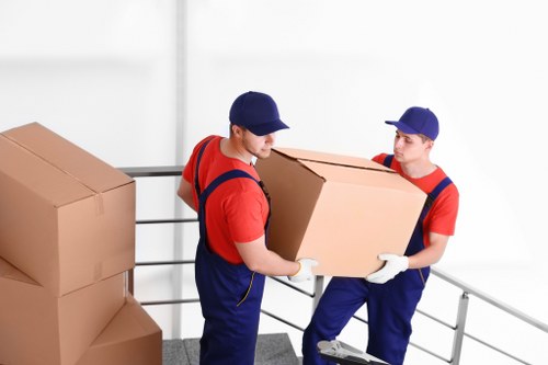 Removal team planning a house move in a busy Soho street
