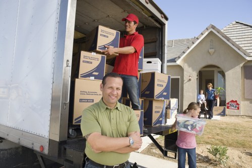 Packed boxes and furniture prepared for a home move in a central London flat