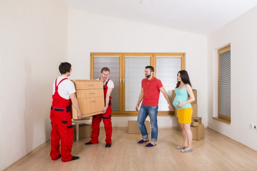 Careful loading of household items for same-day transport in Soho