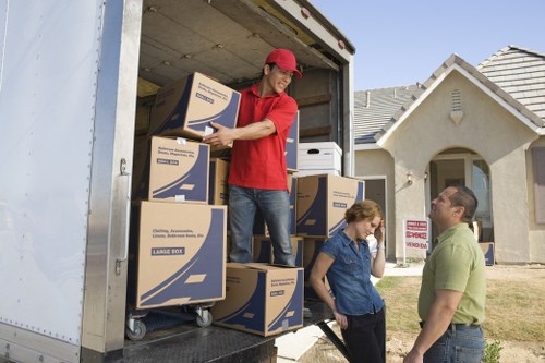Professional movers handling stairs and access in a Soho property