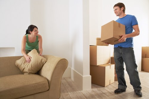 Unpacking household boxes in a Soho apartment after relocation