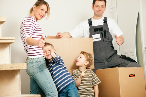Professional packers organising fragile items in a central London flat